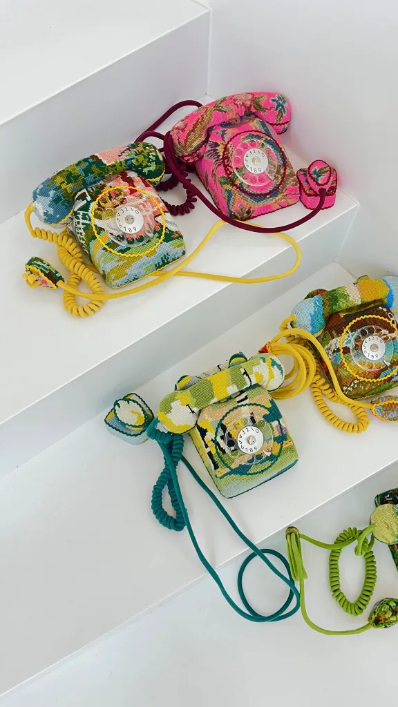 Photo of embroidery -covered desktop rotary telephones