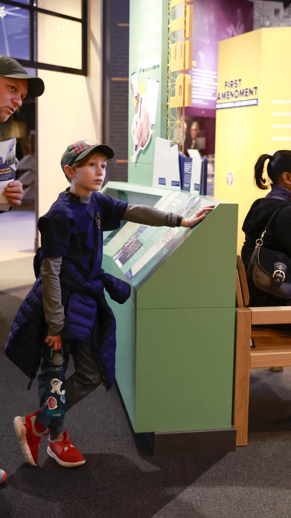 man and boy standing in first amendment gallery