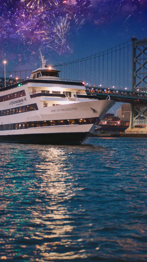 Spirit of Philadelphia vessel with fireworks in the background.