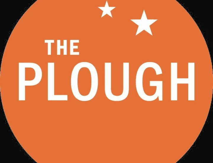 The Plough & the Stars logo with white text on orange circle