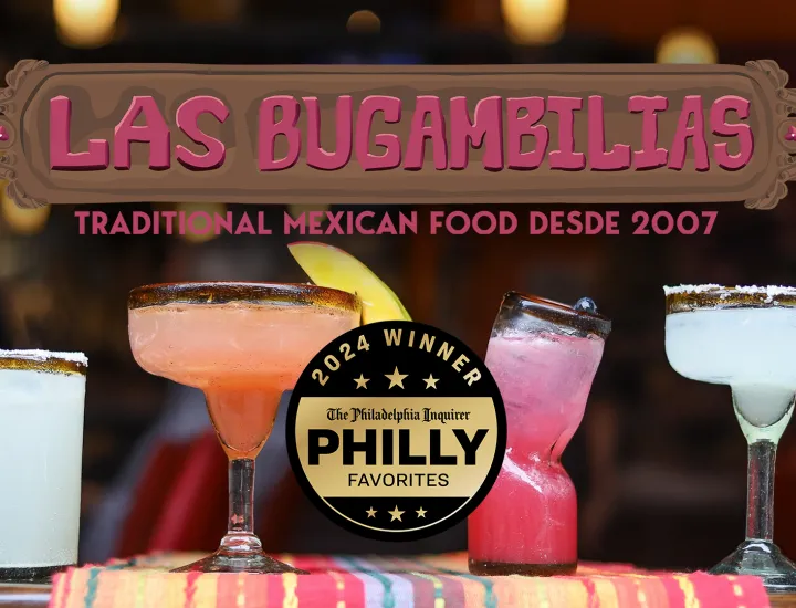 A table with a colorful tablecloth and a line of tasty margaritas and mixed drinks. Las Bugambilias - Traditional Mexican Food Desde 2007. 2024 Winner, The Philadelphia Inquirer Philly Favorites.