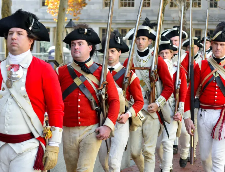 "Redcoats" march through the Museum of the American Revolution's plaza.